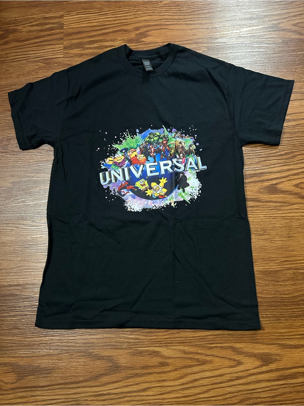 Universal Black Short-Sleeve Graphic Tee with Multicolor Print